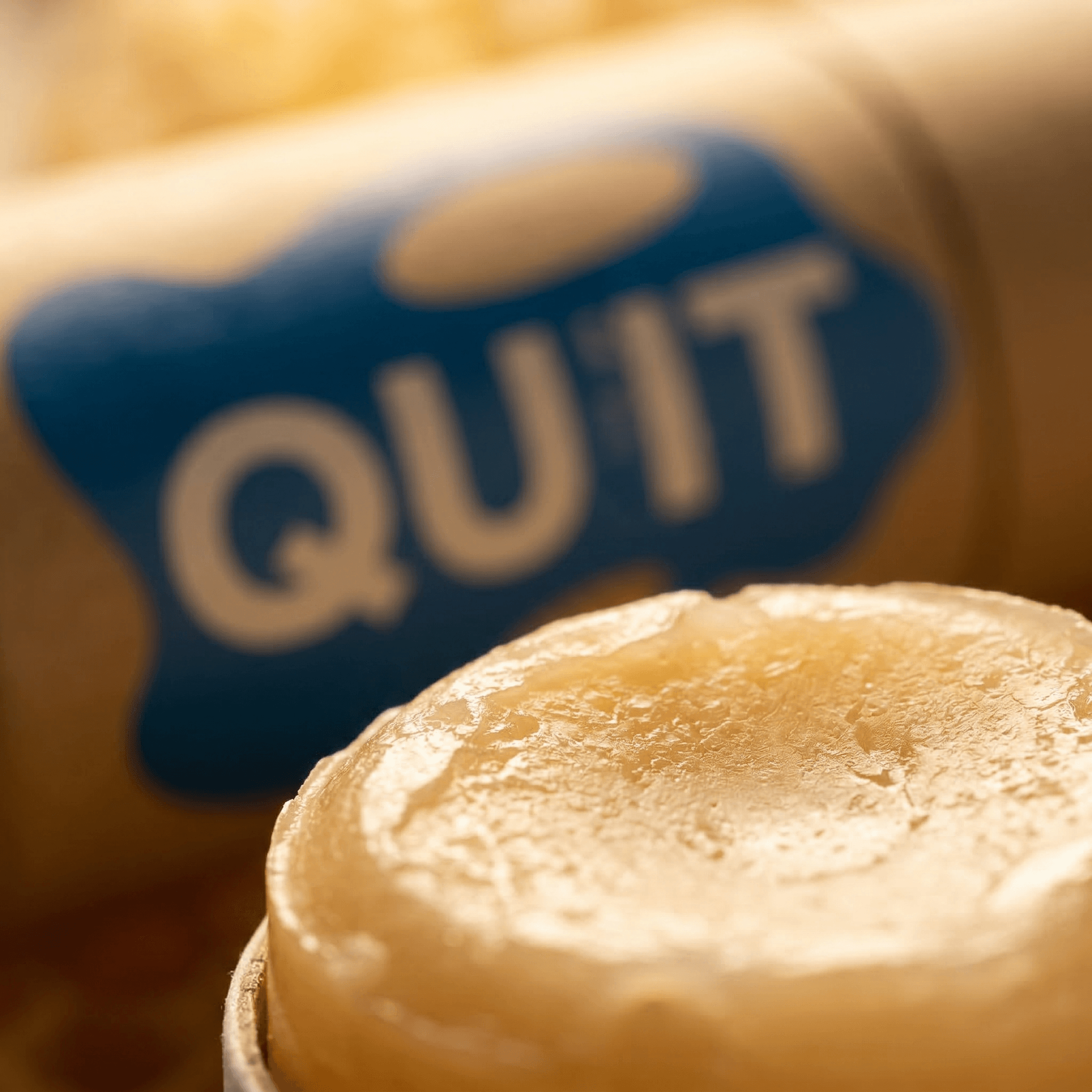 Qufit Stick — wax texture close-up